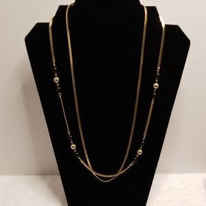Gold color necklace with some beads